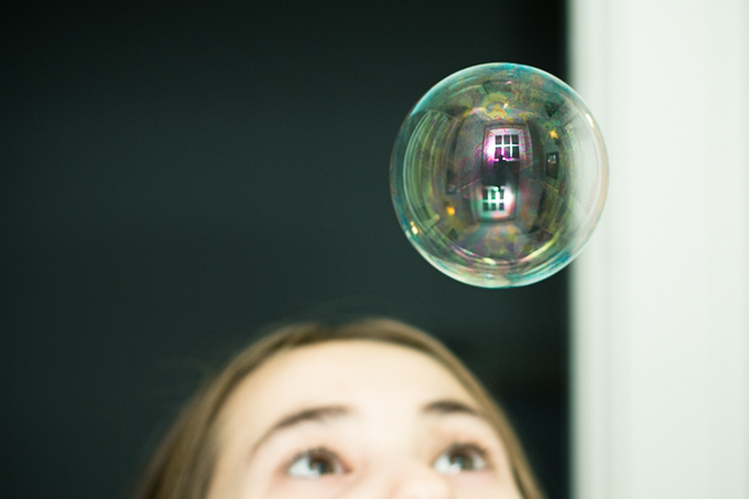 Girl looking at bubble